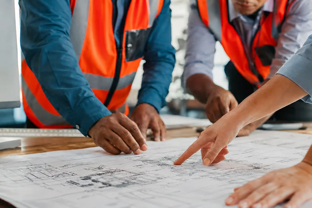 Engineers reviewing drawings on site